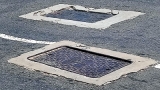 Manhole covers create havoc for motorists