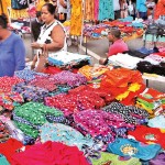 Scenes at Pamunuwa Maharagama: Clothes bought for dollars have to be sold at high prices to cover costs, say traders. Pix by M.A. Pushpa Kumara