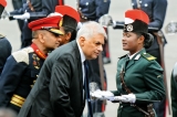 President giving ear to lady cadet officer