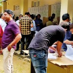 Candidates double checking the lists at the Puttalam Secretariat