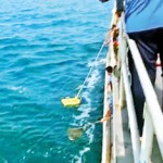Sacks of wet cannabis being washed ashore. Pix courtesy Sri Lanka Navy.
