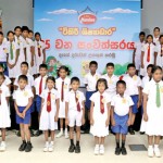 Fifty Munchee Tikiri Shishyadara recipients pose for a  photograph  at  the Munchee factory premises