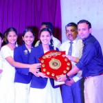 Dr Ashoke priyadarshana, Chief Guest of the Meda Day St Sylvester's College Kandy presenting award to Mahamaya Balika Kandy