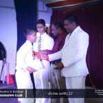 Principal Asela Ravindra Ranasinghe presents awards.