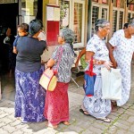 Beneficiaries have to stand in line for days.Pix by Eshan Fernando.