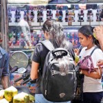 STAJ-03---Pedestrians-drink-king-coconuts-at-the-Pettah-market.