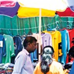 STAJ-06---A-vendor-finds-shelter-under-the-umbrella-in-Pettah