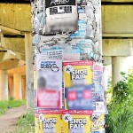 Hunupitiya: Free ad space: A public feature is covered in posters.