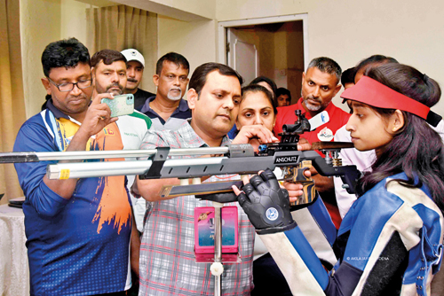 Trainer-Deepak-Kumar-demonstrating-on-how-to-handle-a-gun_-back