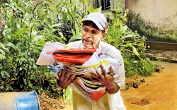 Father evacuated carrying only his child’s school books
