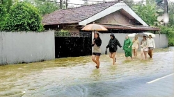 Enjoying a walk on flooded streets