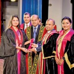 An ACA being presented with his qualification.