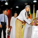 Honouring Dr. C.W.W. Kannangara by placing a bouquet of flowers by grandson looked up-on by the Minister of Education Dr. Susil Premajayantha, Mr Nimal Wakishta and Prof. S. Malimboda.