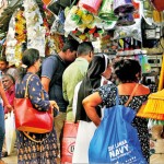 A few items of Christmas decor are strung up as shoppers, few and far between are seen in Pettah. Pix by Nilan Maligaspe