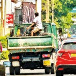 Town Hall Getting by: Hitching a ride Pix by Eshan Fernando