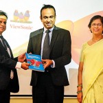 Dr. G. Wijesuriya presenting the National Guidelines to Health Minister Dr. Ramesh Pathirana, while Dr. Padma Gunaratne looks on