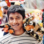 Pettah: Cuddly things: A boy with a soft toy Pix by Akila Jayawardena