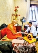 Kelaniya alumni present coffee table book to Mahanayake