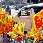 Deans Road Flagging down to sell her flags Pic by Nilan Maligaspe
