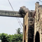 The collapsed overhead bridge at the Egoda Uyana railway station  and right little or no sign of maintenance of the nearly century old structure
