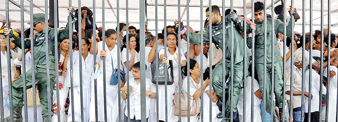 Teeming crowds in queues jostle for breathing space