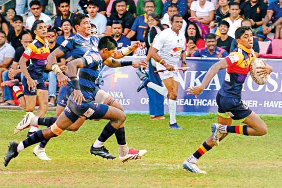 Trinity-fullback-Shan-Althaf-stunned-the-Thomian-defence-to-cover-over-half-of-teh-field-to-brace-a-try---Pic-by-M