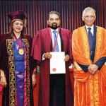 Prof. Sudantha Liyanage receiving the Distinguished Service Award  from Prof Uday Maitra and Prof. Janitha Liyanage