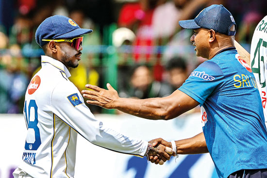 Pathum-Nissanka-(L)-and-coach-Sanath-Jayasuriya-celebrate-Sri-Lanka's-win-in-the-end-of-fourth-day-of-the-second-Test-cricket-match-against-Bangladesh-at-the-SSC---AFP_P20