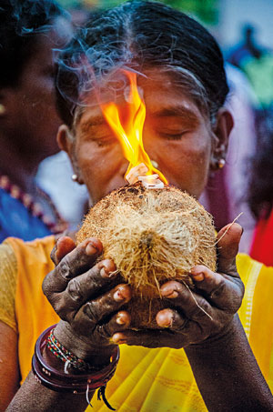 DSC_1142---A-Hindu-devotee-holding-a-coconut-and-burning-camphor---Copy