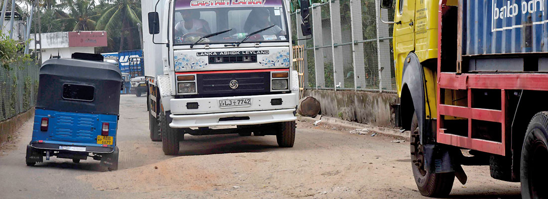 No owners, no repairs for broken road near stadium