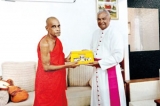Maha Pirith Poth Wahanse presented to Bishop of Galle