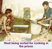Meat being sorted for cooking in the prison