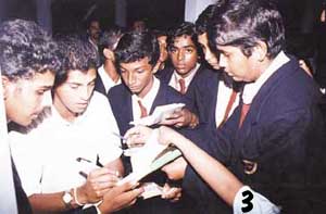 Just one more: Roshan Mahanama obliges some young autograph hunters