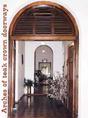 Arches of teak crown doorways