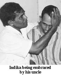 Indika being embraced by his uncle
