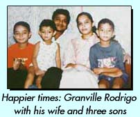 Happier times: Granville Rodrigo with his wife and three sons