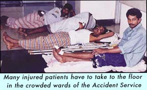 Many injured patients have to take to the floor in the crowded wards of the Accident Service