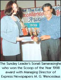 The Sunday Leader's Sonali Samarasinghe who won the Scoop of the Year 1998 award with Managing Director of Express Newspapers M.G. Wenceslaus