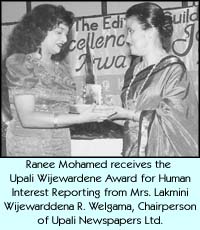 Ranee Mohamed receives the Upali Wijewardene Award for Human Interest Reporting from Mrs. Lakmini Wijewardena R. Welgama, Chairperson of Upali Newspapers Ltd.