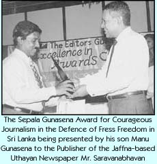 The Sepala Gunasena Award for Courageous Journalism in the Defence of Press Freedom in Sri Lanka being presented by his son Manu Gunasena to the Publisher of the Jaffna-based Uthayan Newspaper Mr. Saravanabhavan