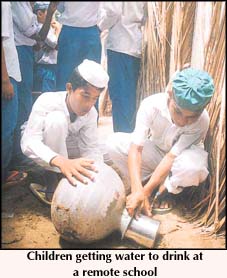 Children getting water to drink at a remote school